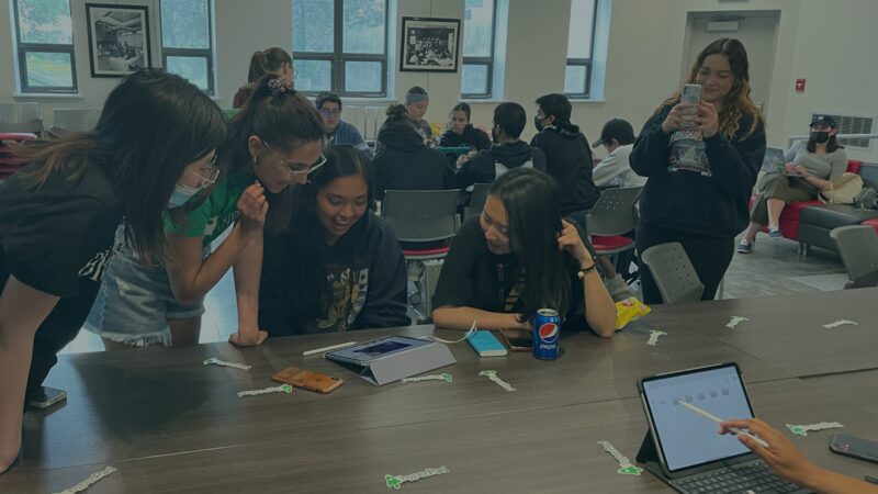 Students collaborating with iPads during a hyperPad Global Game Jam event